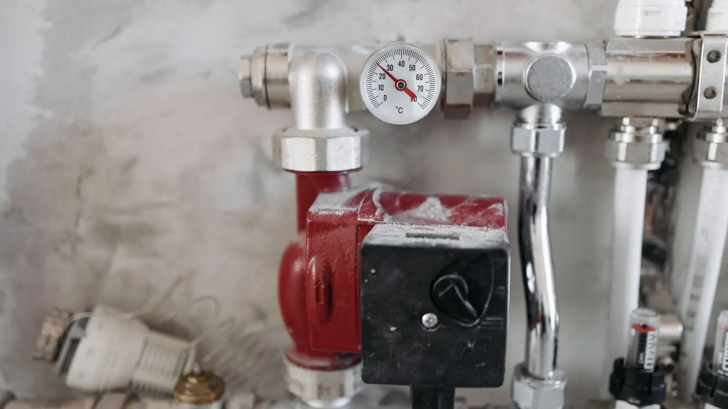 Circulator pump and valves on a hot water header